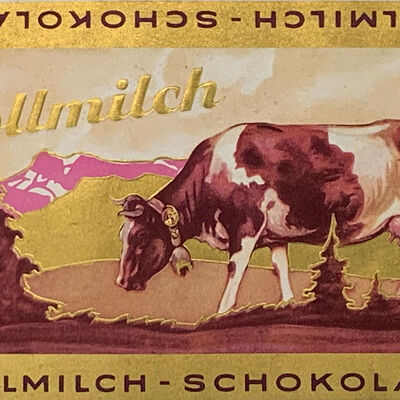 Historisches Schokoladenpapier mit der lila Kuh von Milka